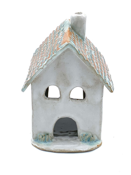 Clay cottage with Teal roof