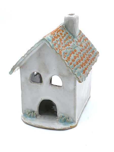 Clay cottage with Teal roof