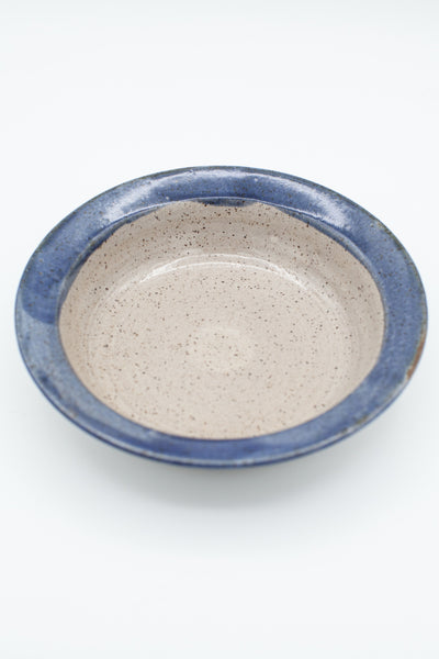 Pasta bowl in speckled clay with Spiced Cream and Blue glaze