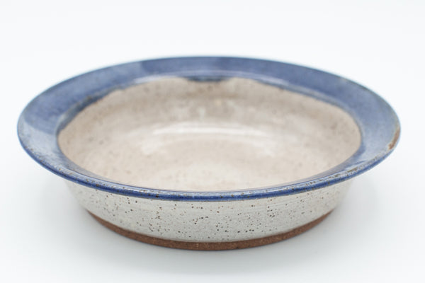 Pasta bowl in speckled clay with Spiced Cream and Blue glaze