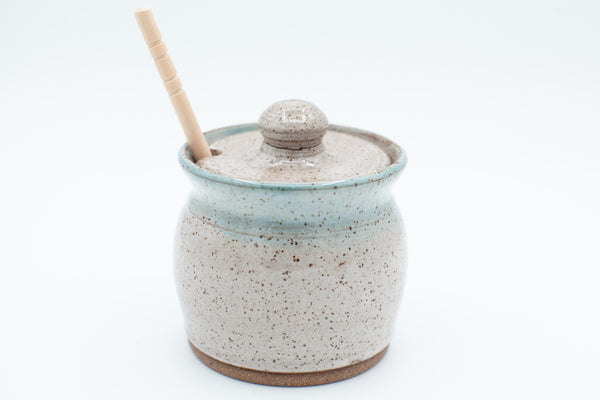 Honey jar in speckled clay with spiced cream and teal glaze