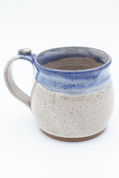 Mug in speckled clay in spiced cream and blue glaze