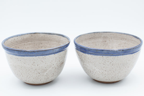 Everyday bowl in speckled clay with spiced cream and blue glaze