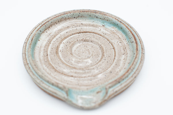 Spoon rest in speckled clay with Spiced Cream and Teal glaze