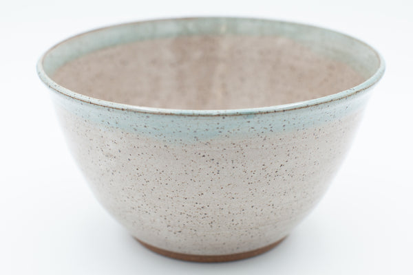 Serving bowl in speckled clay with spiced cream and teal glaze