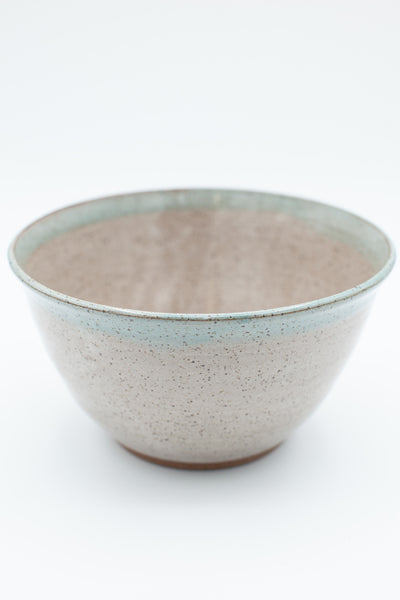 Serving bowl in speckled clay with spiced cream and teal glaze