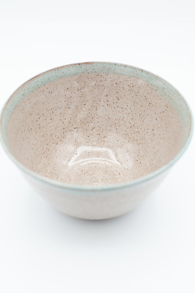 Serving bowl in speckled clay with spiced cream and teal glaze