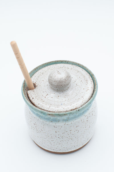 Honey jar in speckled clay with Aspen white and teal glaze