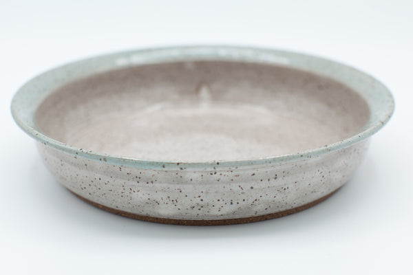 Pasta bowl in speckled clay with Spiced cream and Teal glaze