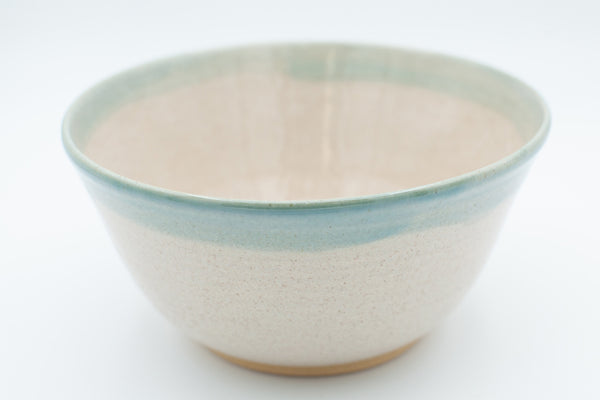Serving bowl in spiced cream and teal glaze