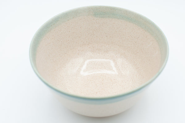 Serving bowl in spiced cream and teal glaze