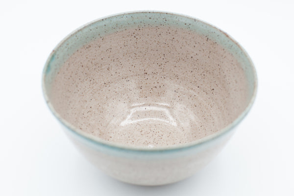 Serving bowl in speckled clay with spiced cream and teal glaze