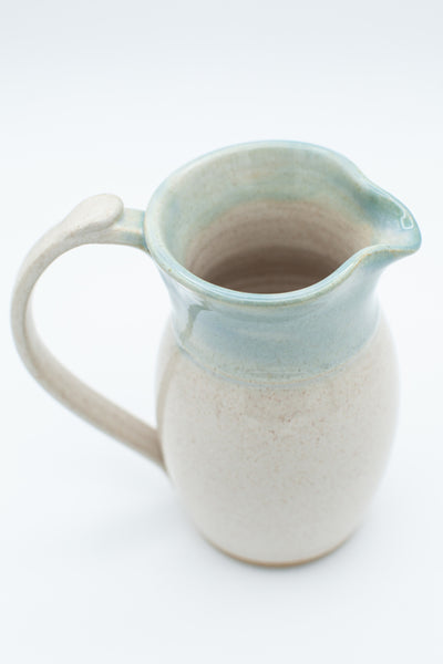 Pitcher in spiced cream and teal glaze