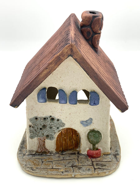 Clay Cottage with cream walls and blue shutters