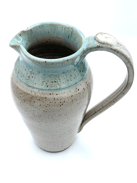 Pitcher in speckled clay in Spiced cream and teal glaze