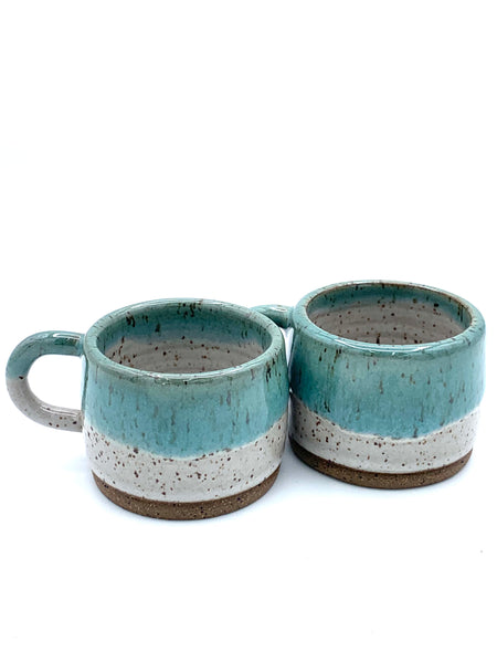 Espresso cup in speckled clay with Spiced cream and Teal glaze