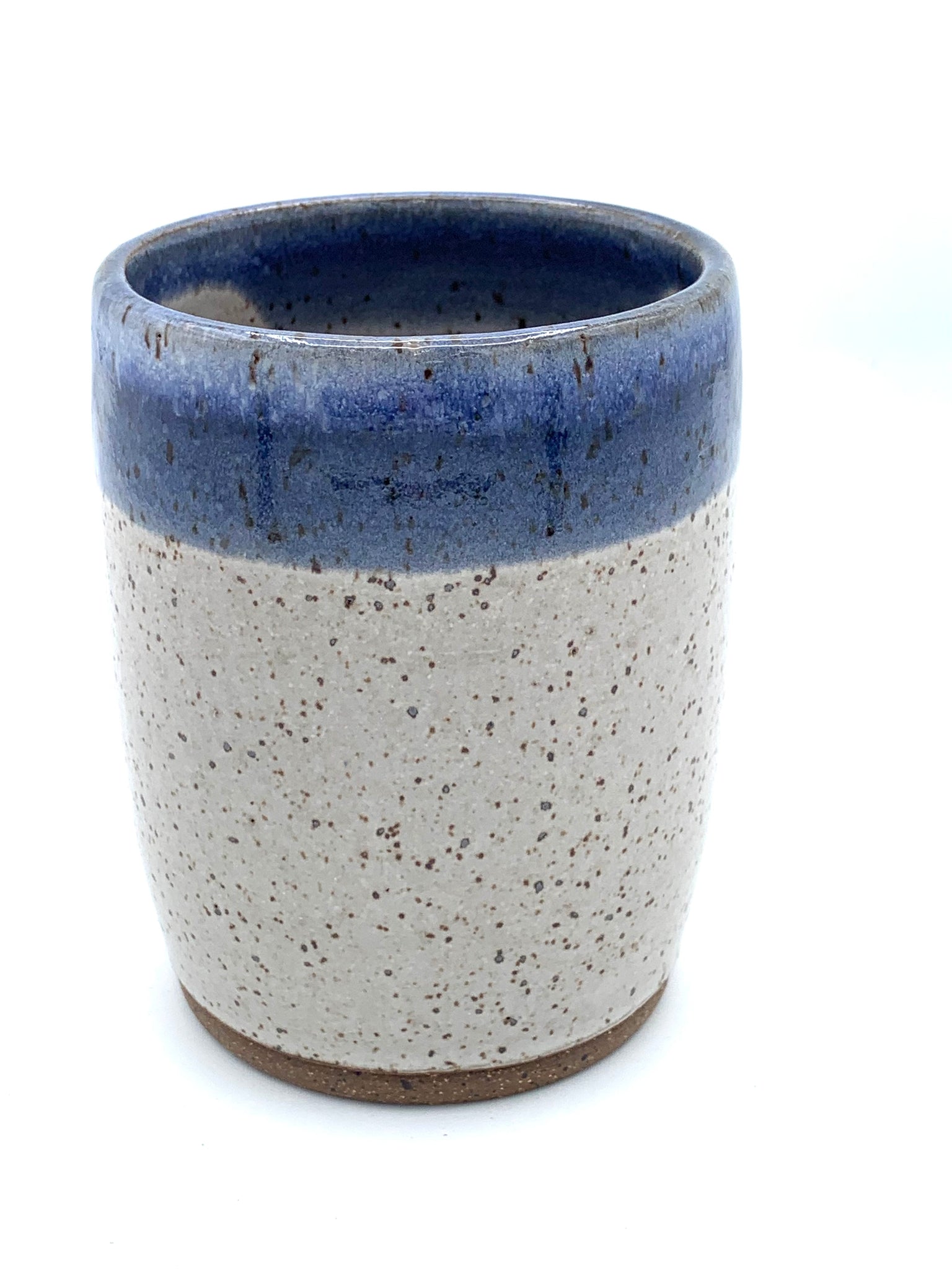 Tumbler in speckled clay with Spiced cream and Blue glaze
