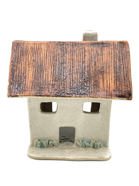 Clay Cottage with rusty roof