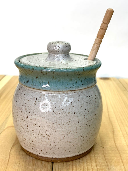 Honey jar in speckled clay with spiced cream and teal glaze