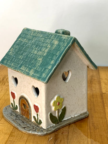 Clay cottage with a Teal roof