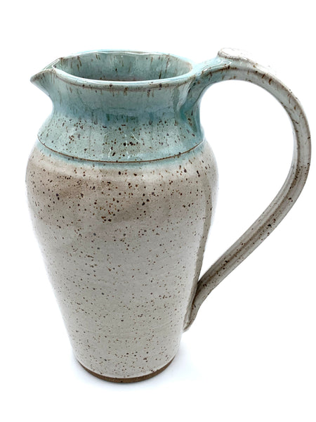 Pitcher in speckled clay in Spiced cream and teal glaze