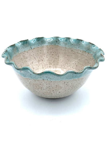 Bowl with scalloped rim in speckled clay with Spiced cream and Teal glaze