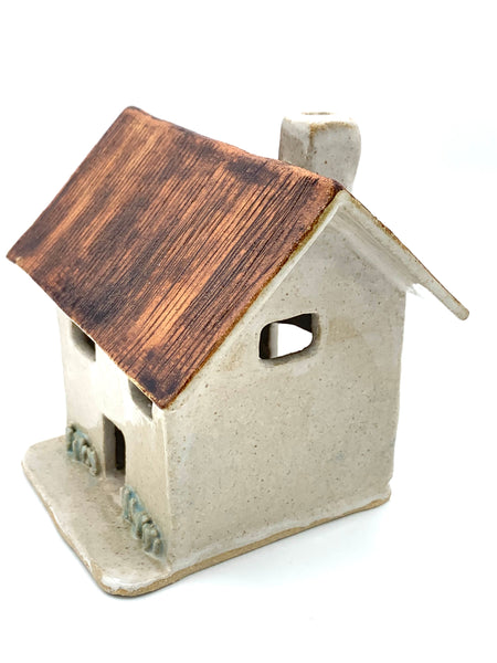 Clay Cottage with rusty roof
