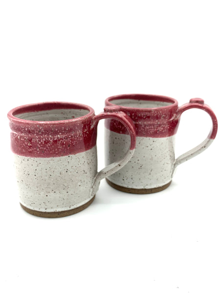 Mug in speckled clay with Spiced Cream and Raspberry glaze