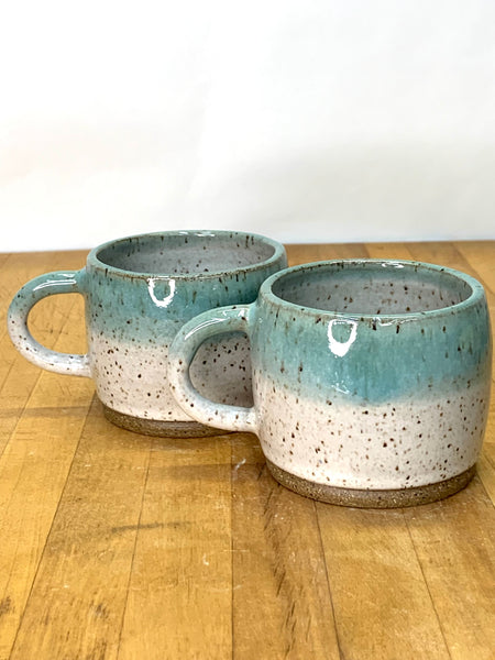 Espresso cup in speckled clay with Spiced cream and Teal glaze