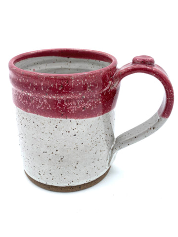 Mug in speckled clay with Spiced Cream and Raspberry glaze