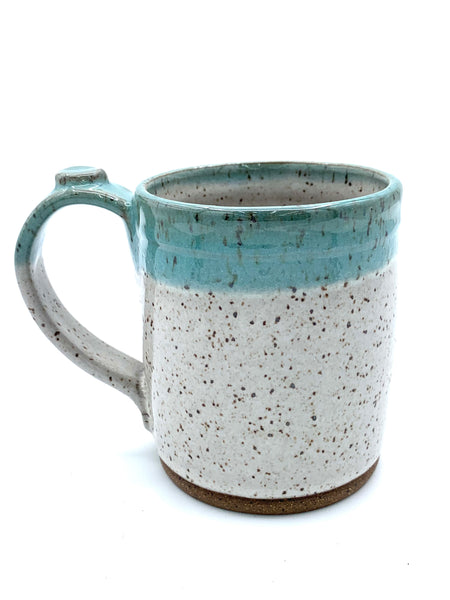 Mug in speckled clay with Aspen white and Teal glaze