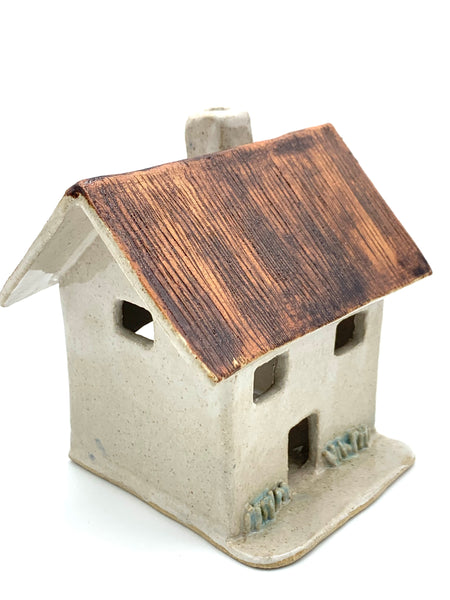 Clay Cottage with rusty roof