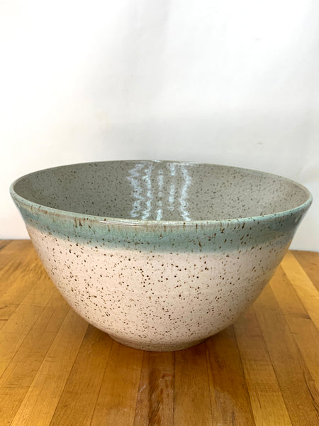 Serving bowl in speckled clay with spiced cream and teal glaze