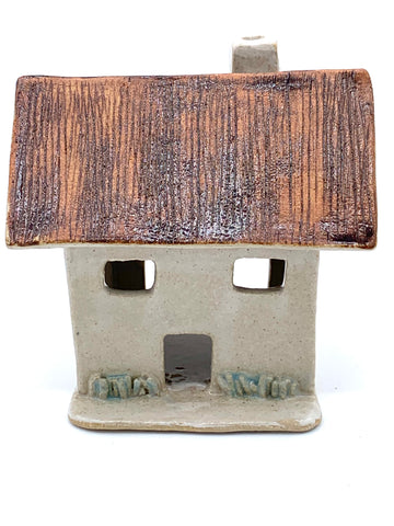 Clay Cottage with rusty roof