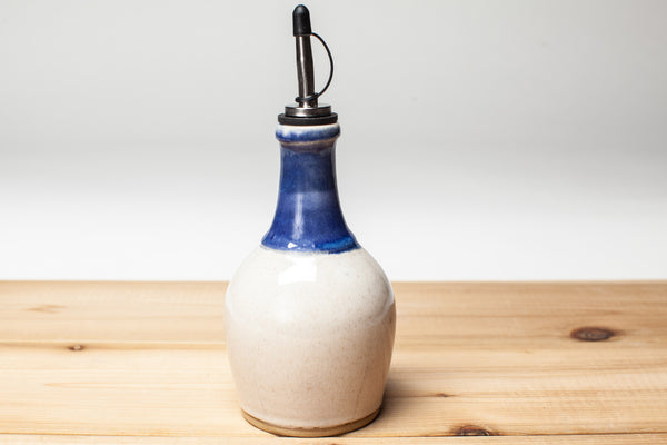 Oil bottle in spiced cream and blue glaze