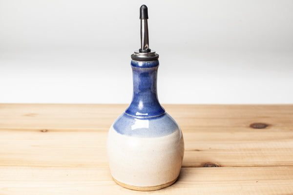 Oil bottle in spiced cream and blue glaze