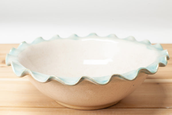 Bowl with fluted rim in Spiced Cream and Teal glaze