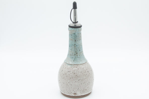 Oil Bottle in speckled clay with Spiced Cream and Teal glaze