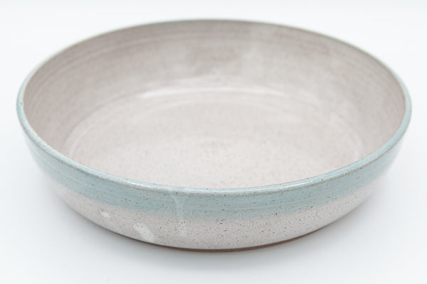 Bowl in speckled clay with Spiced Cream and Teal glaze