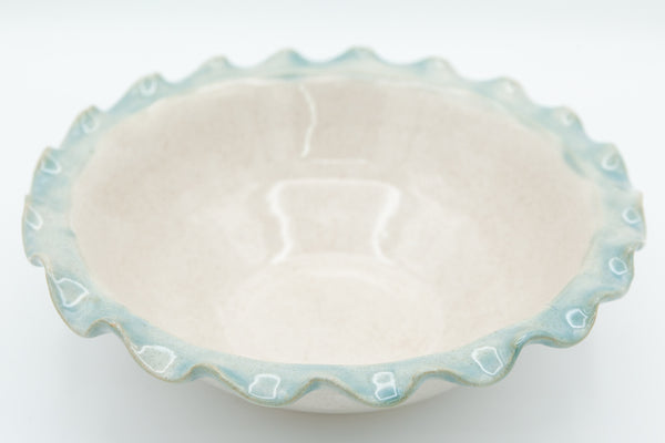 Bowl with fluted rim in Spiced Cream and Teal glaze