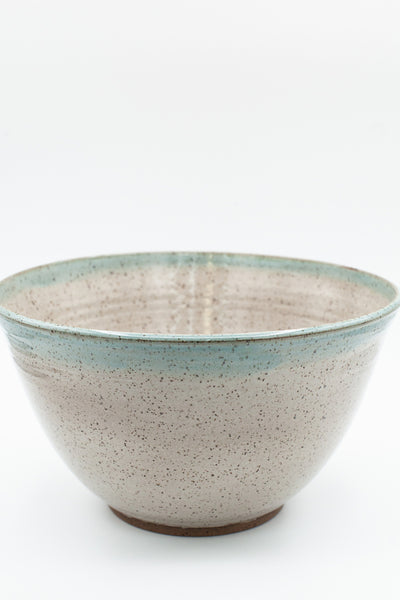 Bowl in speckled clay with Siced Cream and Teal glaze