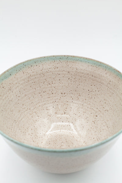 Bowl in speckled clay with Siced Cream and Teal glaze