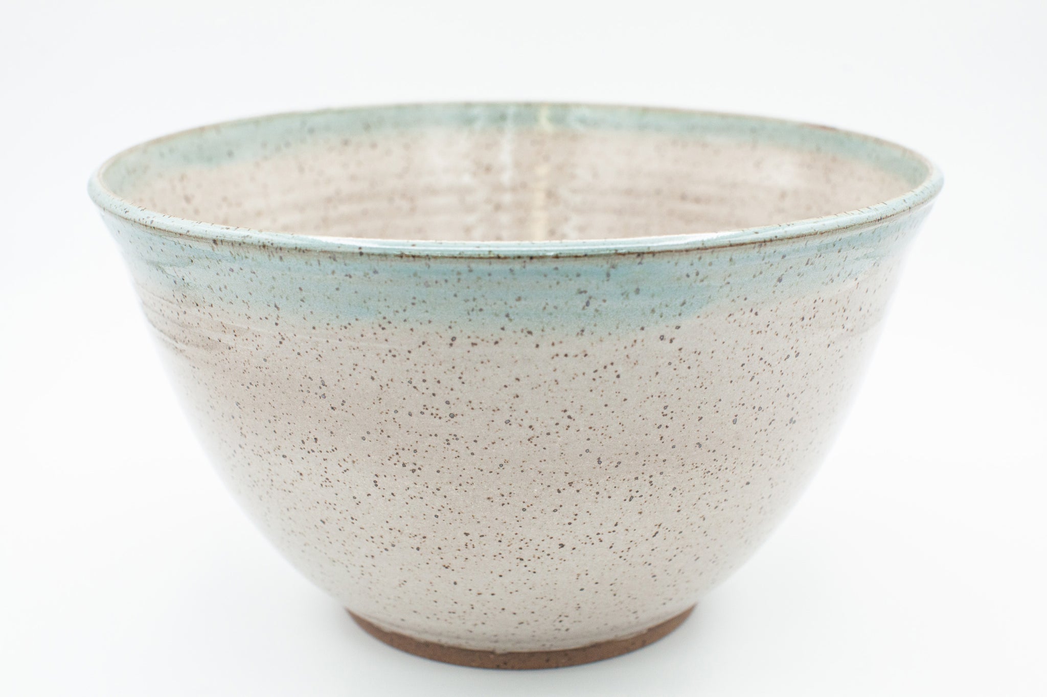 Bowl in speckled clay with Siced Cream and Teal glaze