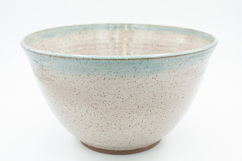 Bowl in speckled clay with Siced Cream and Teal glaze