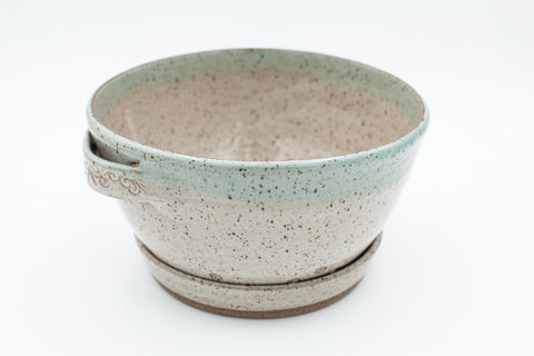 Berry bowl in speckled clay with Spiced Cream and Teal glaze