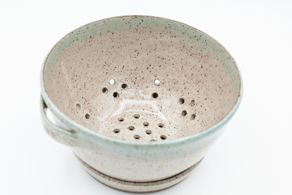 Berry bowl in speckled clay with Spiced Cream and Teal glaze