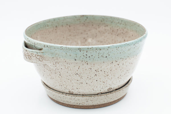 Berry bowl in speckled clay with Spiced Cream and Teal glaze