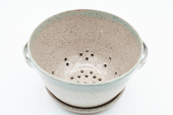 Berry bowl in speckled clay with Spiced Cream and Teal glaze