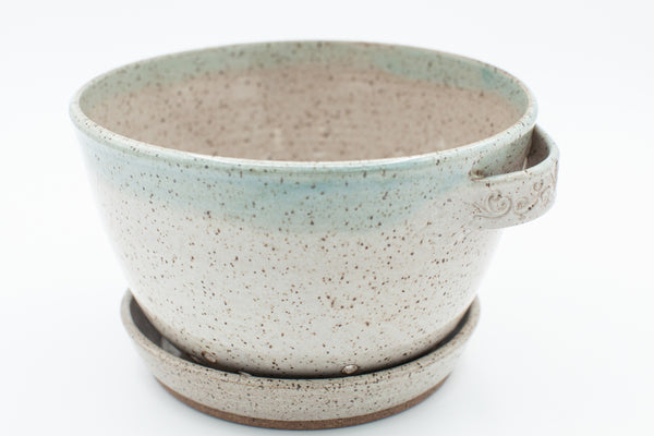 Berry bowl in speckled clay with Spiced Cream and Teal glaze