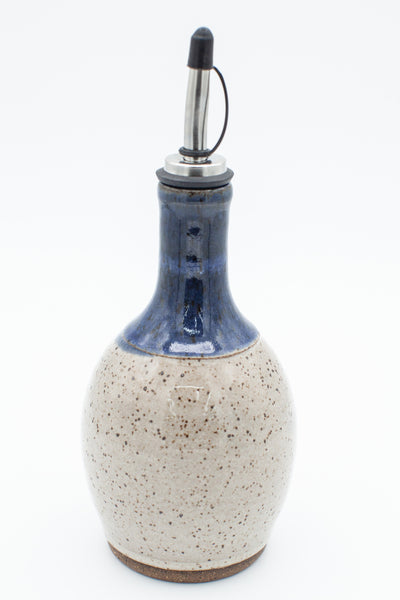 Oil bottle in speckled clay with Spiced Cream and Blue glaze